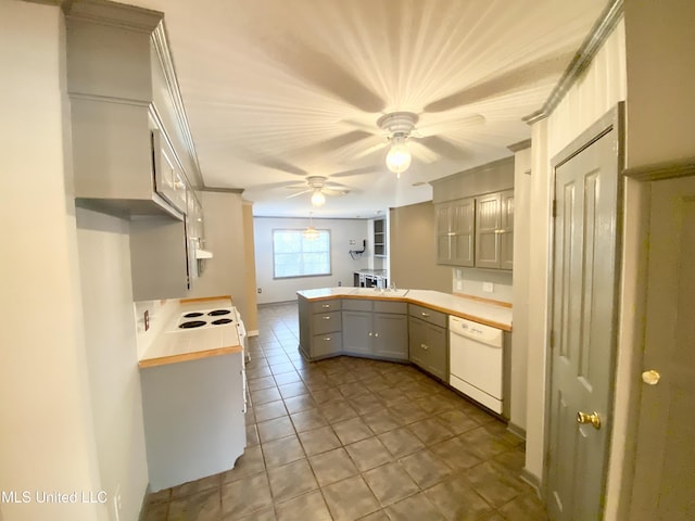 kitchen with gray cabinetry, ceiling fan, dishwasher, kitchen peninsula, and light tile patterned floors