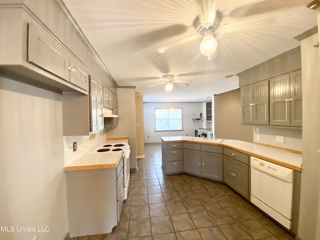 kitchen with gray cabinetry, white appliances, dark tile patterned floors, butcher block countertops, and kitchen peninsula