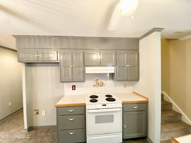 kitchen featuring electric range and ornamental molding