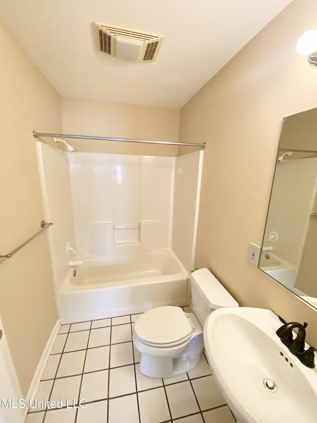 full bathroom with tile patterned floors, toilet, sink, and shower / washtub combination