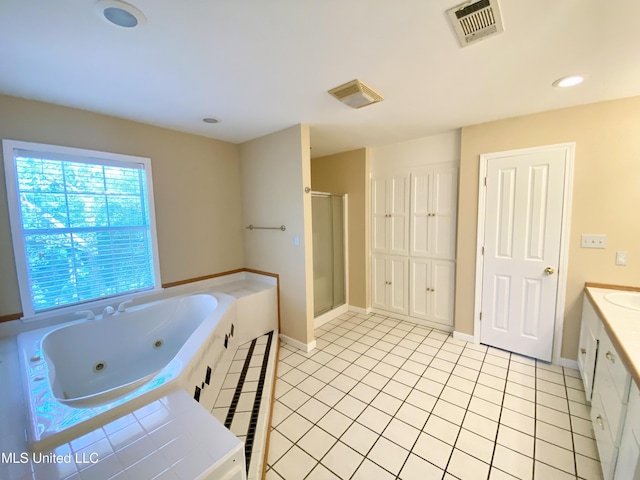 bathroom with vanity, tile patterned floors, and separate shower and tub