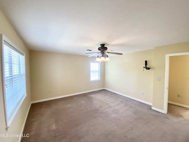 unfurnished room with carpet flooring, plenty of natural light, and ceiling fan