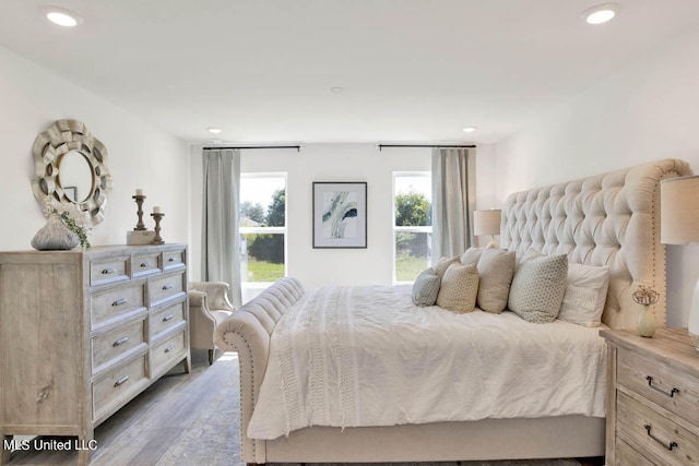 bedroom with hardwood / wood-style flooring