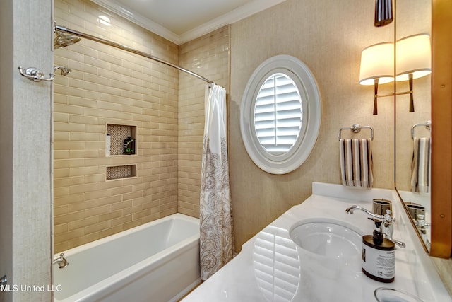 bathroom with sink, ornamental molding, and shower / bath combination with curtain