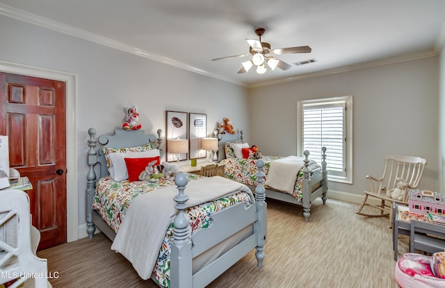 bedroom with ceiling fan and crown molding