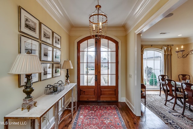 doorway featuring a notable chandelier, dark hardwood / wood-style flooring, french doors, and a healthy amount of sunlight