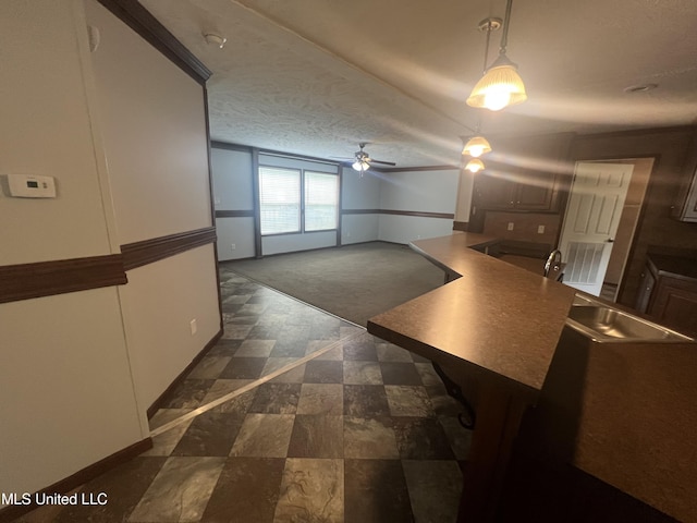 interior space with a sink and ceiling fan