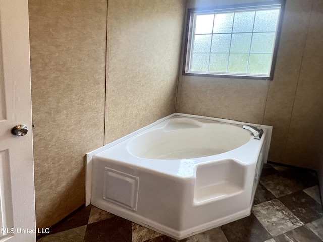 bathroom featuring a bath