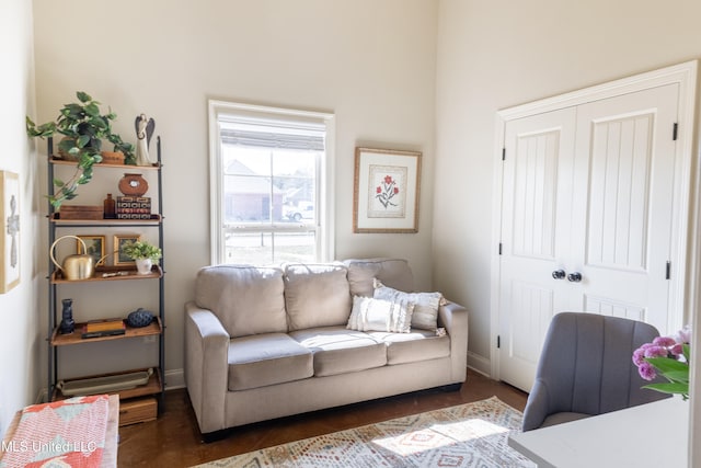 interior space with wood finished floors and baseboards