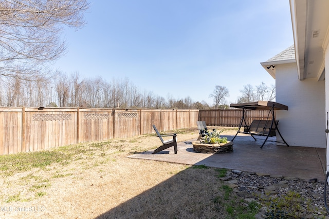 view of yard featuring a fenced backyard and a patio