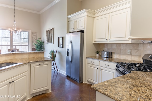 kitchen featuring appliances with stainless steel finishes, crown molding, light stone counters, and decorative backsplash