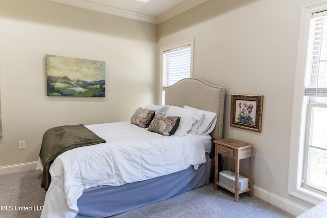 carpeted bedroom featuring baseboards and ornamental molding