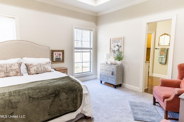 carpeted bedroom with baseboards and crown molding