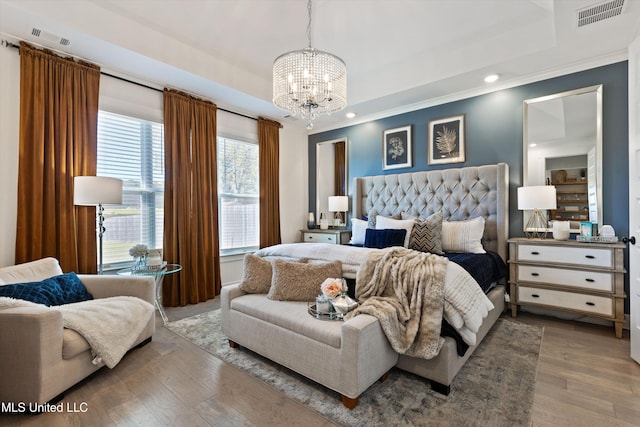 4975 Longmire Ln, Olive Branch, MS 38654 - bedroom featuring a chandelier, a tray ceiling, wood finished floors, crown molding, and recessed lighting