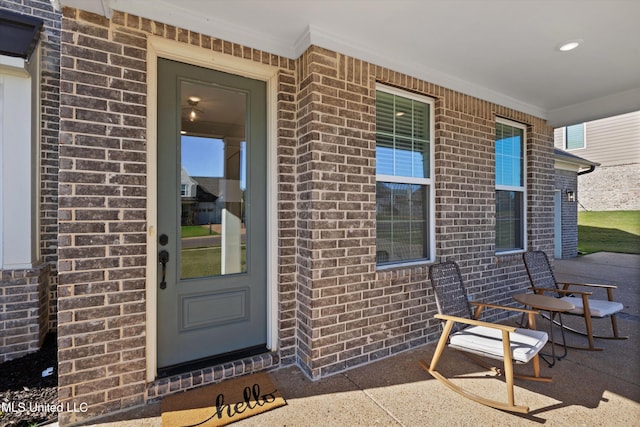 4975 Longmire Ln, Olive Branch, MS 38654 - view of exterior entry featuring brick siding