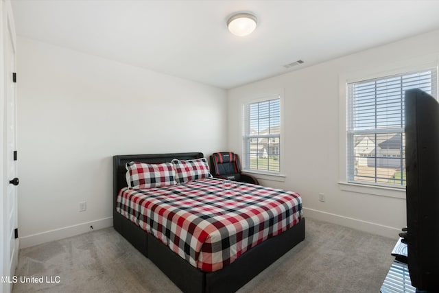 4975 Longmire Ln, Olive Branch, MS 38654 - carpeted bedroom with baseboards and multiple windows
