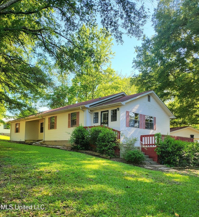 98 Danny Ln, Sardis, MS 38666 - view of front of property with a front lawn and a wooden deck