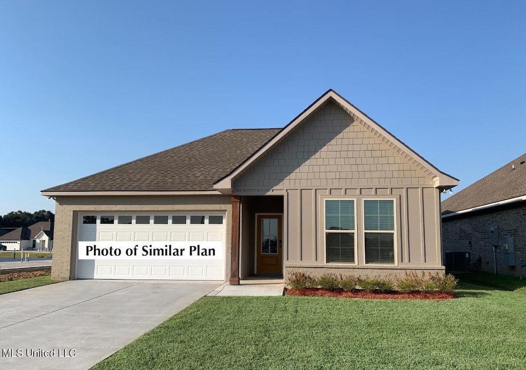16 Gant Ln, Long Beach, MS 39560 - view of front of property featuring concrete driveway, a garage, board and batten siding, a front yard, and a shingled roof