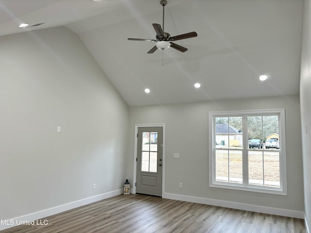 entryway featuring ceiling fan, lofted ceiling, and light hardwood / wood-style floors