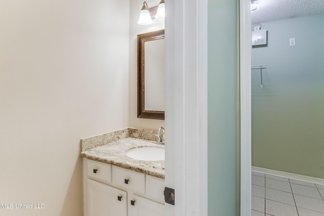 bathroom featuring vanity and tile patterned flooring