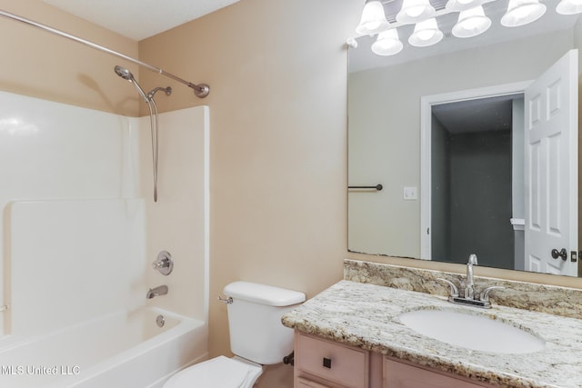 bathroom with washtub / shower combination, toilet, and vanity