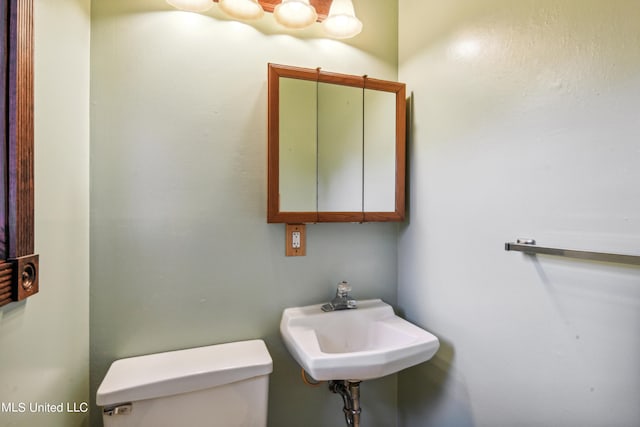 bathroom with sink and toilet