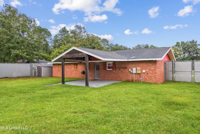 back of house with a patio area and a lawn