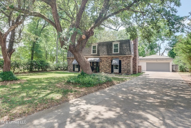 311 Westview Dr, Biloxi, MS 39531 - view of front of property featuring brick siding, a front lawn, a detached garage, and mansard roof