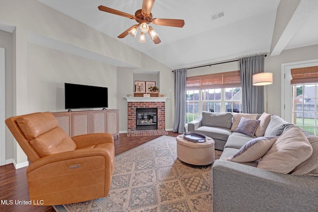 13245 Braybourne Pkwy, Olive Branch, MS 38654 - living area featuring wood finished floors, a ceiling fan, vaulted ceiling, baseboards, and a brick fireplace
