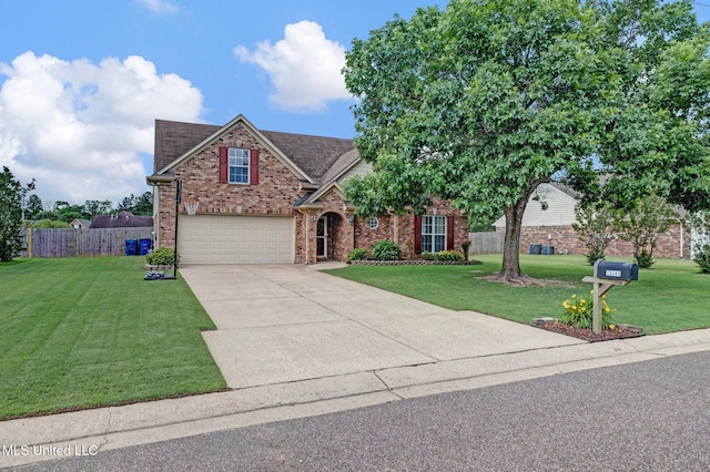 13245 Braybourne Pkwy, Olive Branch, MS 38654 - traditional home with brick siding, an attached garage, driveway, and roof with shingles