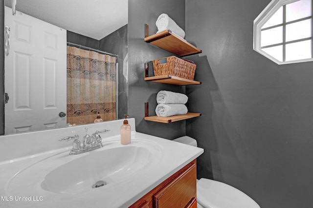 13245 Braybourne Pkwy, Olive Branch, MS 38654 - full bathroom featuring toilet, vanity, and a shower with shower curtain