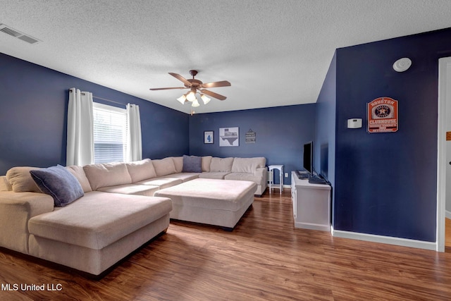 13245 Braybourne Pkwy, Olive Branch, MS 38654 - living area featuring ceiling fan, wood finished floors, a textured ceiling, and baseboards