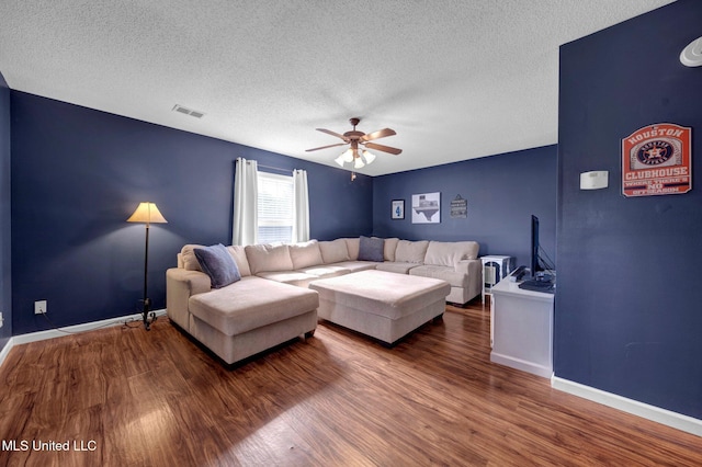 13245 Braybourne Pkwy, Olive Branch, MS 38654 - living room with wood finished floors, a textured ceiling, ceiling fan, and baseboards