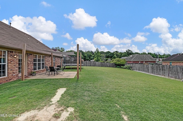 13245 Braybourne Pkwy, Olive Branch, MS 38654 - view of yard featuring a trampoline and a patio