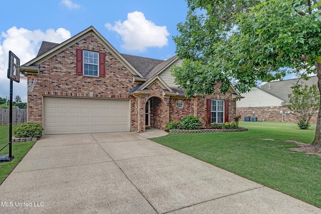 13245 Braybourne Pkwy, Olive Branch, MS 38654 - traditional-style house featuring brick siding, driveway, an attached garage, and a shingled roof