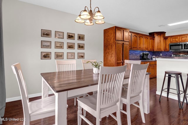 13245 Braybourne Pkwy, Olive Branch, MS 38654 - dining space featuring a chandelier and dark wood-style flooring
