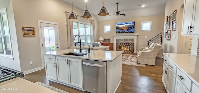 13453 Birch Bnd, Olive Branch, MS 38654 - kitchen with a sink, dishwasher, a brick fireplace, open floor plan, and white cabinetry