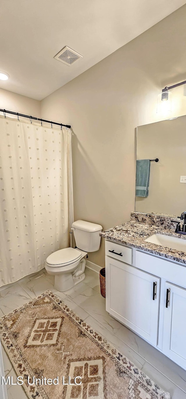 13453 Birch Bnd, Olive Branch, MS 38654 - bathroom featuring toilet, vanity, marble look tiles, and curtained shower