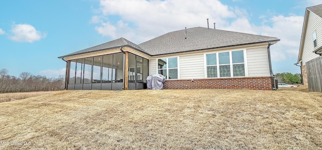 13453 Birch Bnd, Olive Branch, MS 38654 - rear view of house with a sunroom, brick siding, and roof with shingles