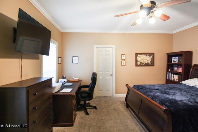 carpeted bedroom featuring crown molding and ceiling fan