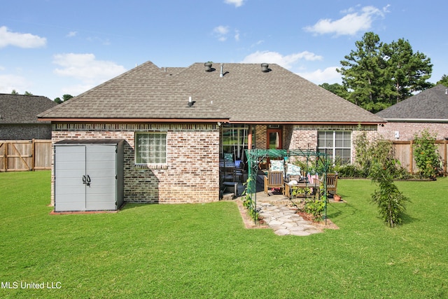 rear view of property with a patio area and a yard