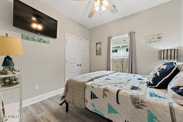 bedroom featuring ceiling fan, a closet, and light hardwood / wood-style flooring