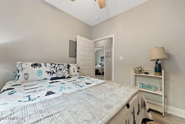 bedroom with light hardwood / wood-style flooring and ceiling fan