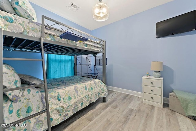 208 Sycamore St, Bay Saint Louis, MS 39520 - bedroom featuring wood finished floors and baseboards