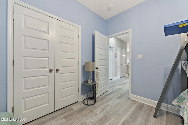 208 Sycamore St, Bay Saint Louis, MS 39520 - hallway with light wood-style flooring and baseboards