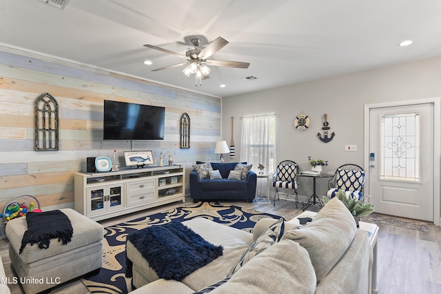 208 Sycamore St, Bay Saint Louis, MS 39520 - living room featuring wood walls, recessed lighting, ceiling fan, and wood finished floors