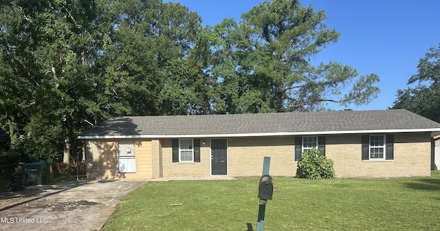 5736 Eastwood Dr, Moss Point, MS 39563 - ranch-style home with brick siding, a front lawn, and roof with shingles