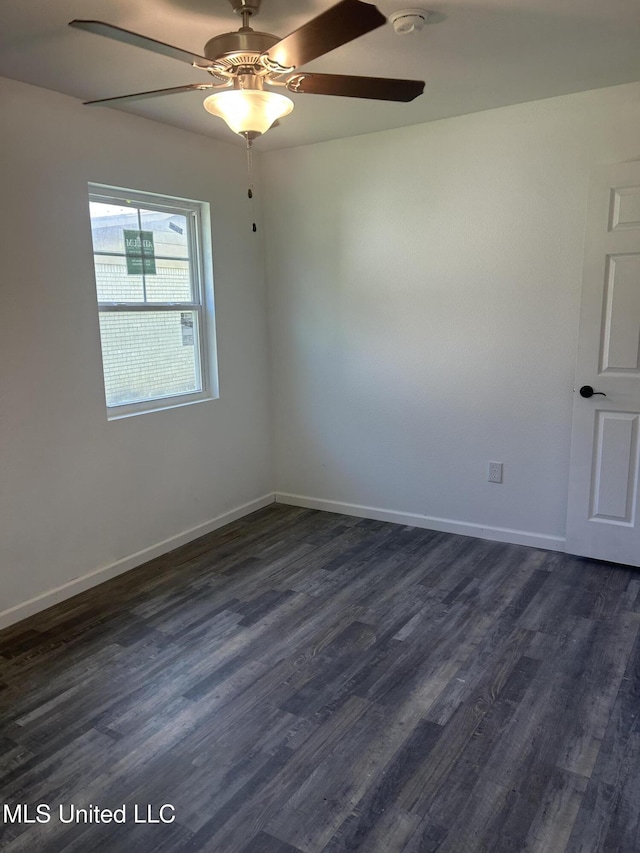 5736 Eastwood Dr, Moss Point, MS 39563 - unfurnished room with dark wood finished floors, ceiling fan, and a smoke detector