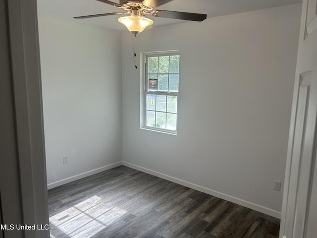 5736 Eastwood Dr, Moss Point, MS 39563 - spare room with dark wood-type flooring and ceiling fan