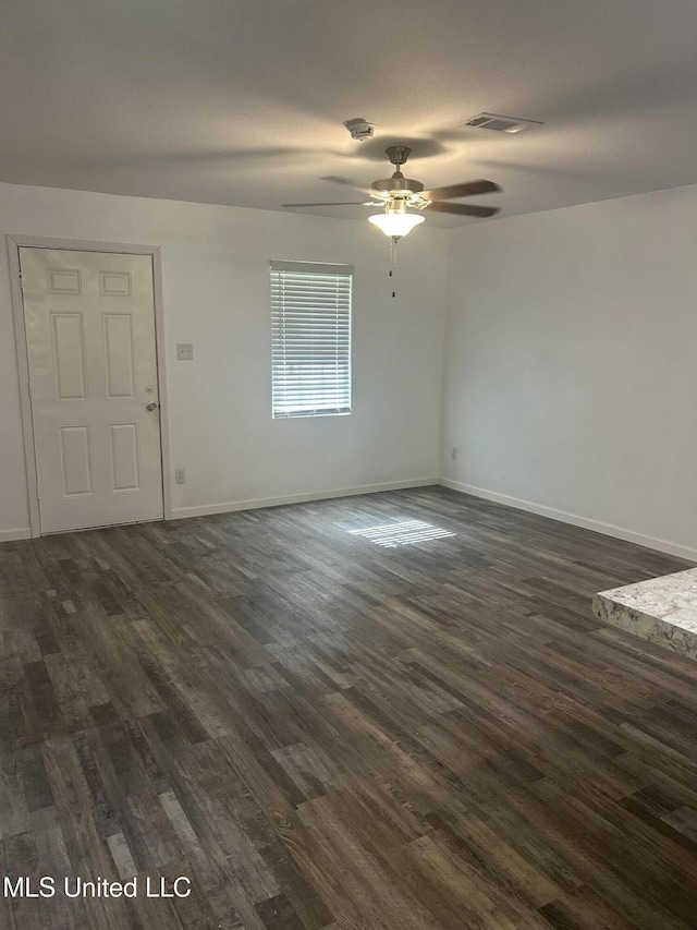 5736 Eastwood Dr, Moss Point, MS 39563 - unfurnished living room featuring dark wood-style floors and a ceiling fan